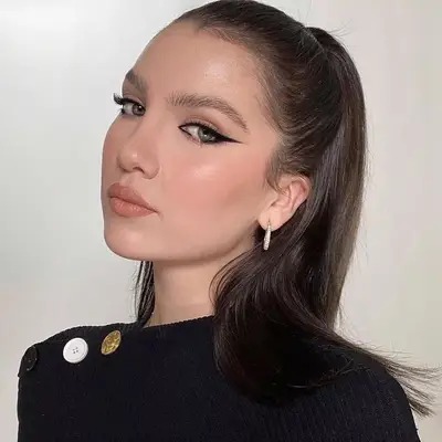 Maya Henry with abstract black eyeliner and a nude lip