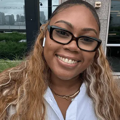 Essence wearing Glossier Boy Boy Brow Arch