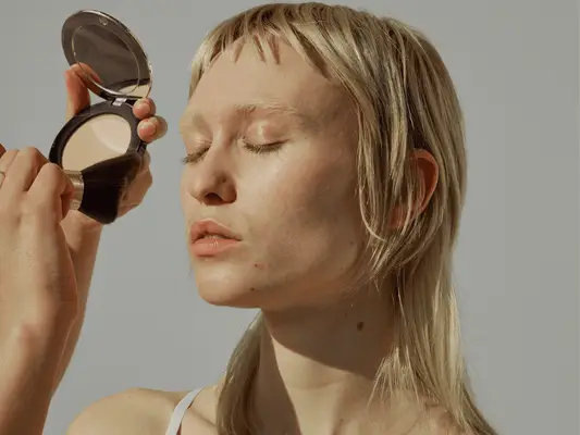 Model gets ready for makeup before shooting