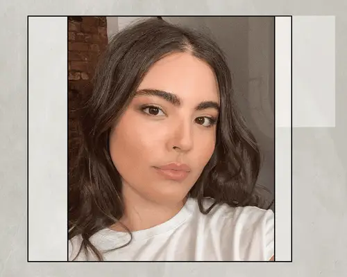 woman with clear skin and natural makeup in white t-shirt