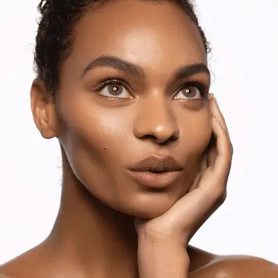 Hazel eyes lined with warm bronze brown eyeliner