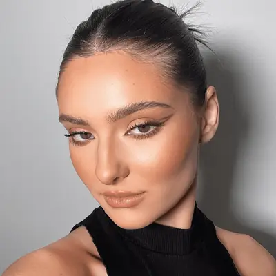 Lily Collins with a fluorescent pink halo eye makeup look