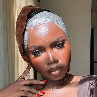 Blonde model with pale pink matte eyeshadow accentuating her hazel eyes