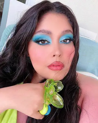 Woman with blue eyeshadow and liner