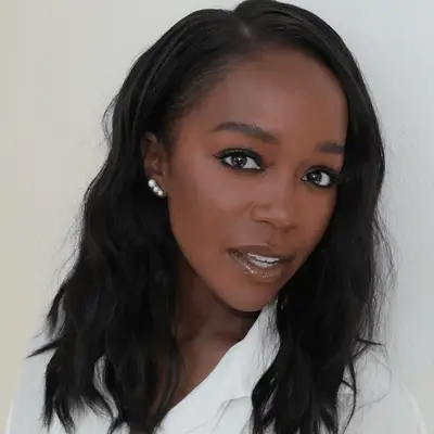 aja naomi king wearing eyeliner, lashes, and gloss