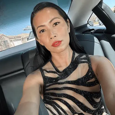 model wearing dewy, peach makeup