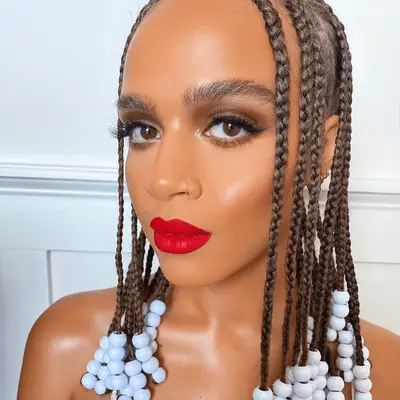 woman wearing red lipstick and brown eyeshadow