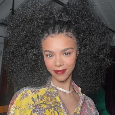 model wearing red lipstick and rosy blush