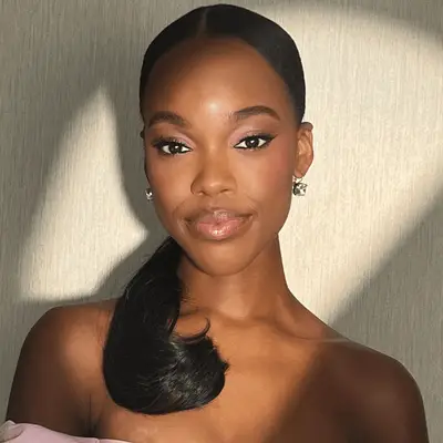 model wearing pink eyeshadow and lip gloss