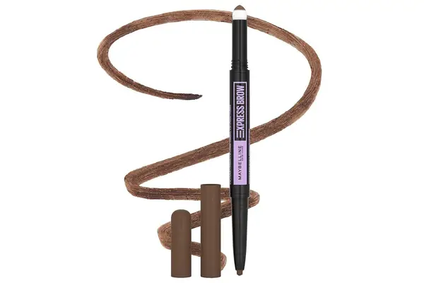 Hand holding a brush going to use the Anastasia Beverly Hills Brow Powder Duo