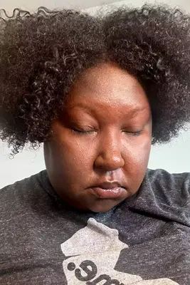 A person after applying Honest Beauty Extreme Length Mascara + Lash Primer