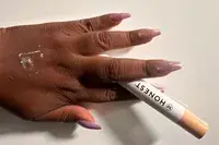 Honest Beauty Extreme Length Mascara + Lash Primer on the back of a person