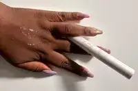 Tarte Opening Act Lash Primer applied to the back of a person