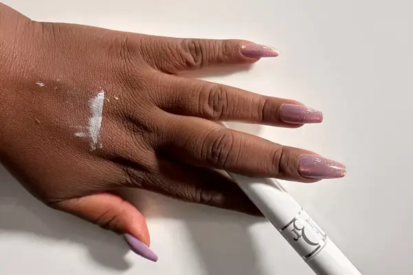 Dior Diorshow Maximizer 3D Triple Volume Plumping Lash Primer applied to the back of a person