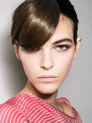 woman with red mascara on