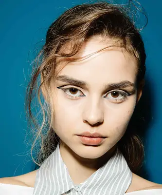 model wearing eyeliner marker in graphic design