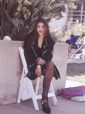 Kim Kardashian wears a neutral rosy-toned makeup look with matte skin and nude lipstick