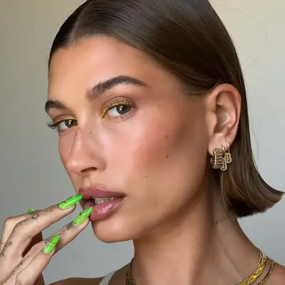 Hailey Bieber wearing yellow eyeliner