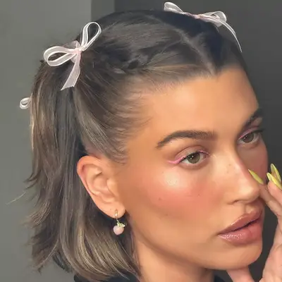 Hailey Bieber wearing Neon pink eyeliner