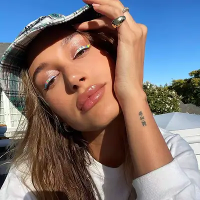 Hailey Bieber wearing holographic Rainbow eyeliner