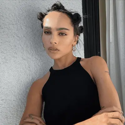 zoe kravitz with smoky makeup and bantu knots