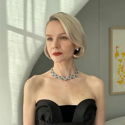 Woman with blonde hair wearing dark red lipstick