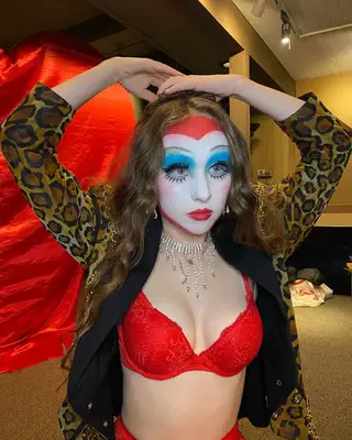 Chappell Roan wearing blue and red makeup. 
