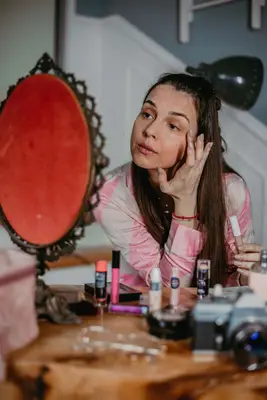 Woman applying makeup