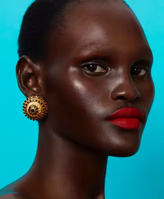 model wears bold matte red lip 