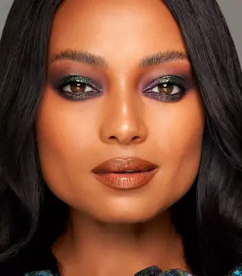 model wears smoky metallic eyeshadow