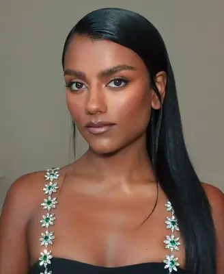 model wears natural makeup look with frosted lips