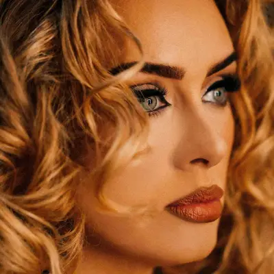 Adele with black winged liner, lashes, green eyes, ombre lips, and matte skin