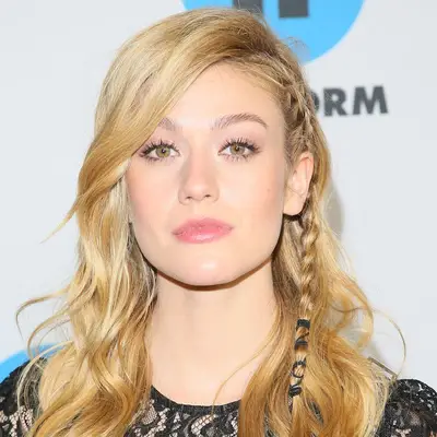 Katherine McNamara wears pastel pink eyeshadow, subtle pink lipstick, and blush