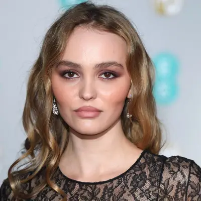Lily-Rose Depp with fluffy brows and neutral makeup.