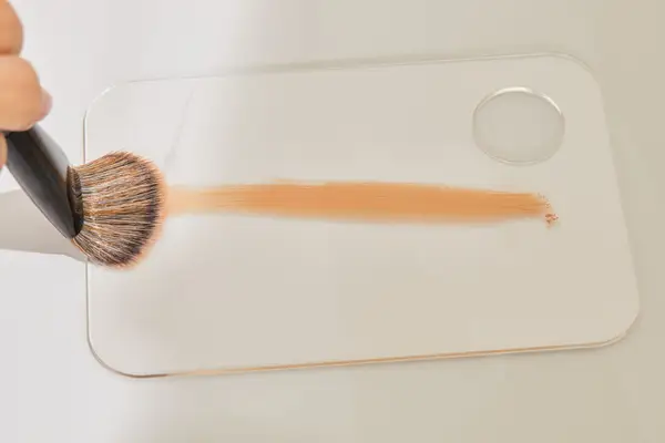 A person tests the Sephora Collection PRO Foundation Brush #47