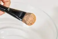 Close-up of a Sephora Collection PRO Foundation Brush #47 covered in foundation