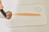 A person tests the Sephora Collection PRO Foundation Brush #47