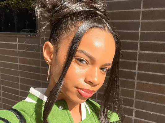 woman wearing shiny lipstick in sunlight