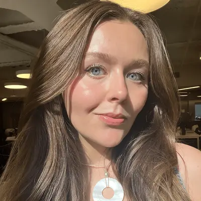 Holly Rhue, associate editorial director, wearing glossy pink lip