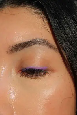 A person close-up after using the MAC Colour Excess Gel Pencil Eye Liner