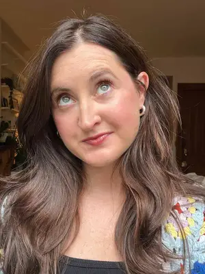 A person after applying the YSL Lash Clash Extreme Volume Mascara