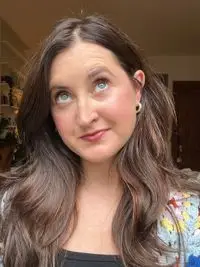 A person after applying the YSL Lash Clash Extreme Volume Mascara