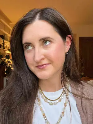 A person after applying the Maybelline Lash Sensational Sky High Lengthening Mascara