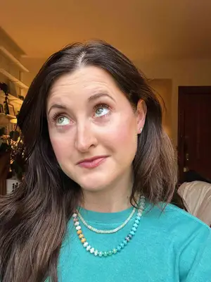 A person after applying the Dior Diorshow Iconic Overcurl Mascara