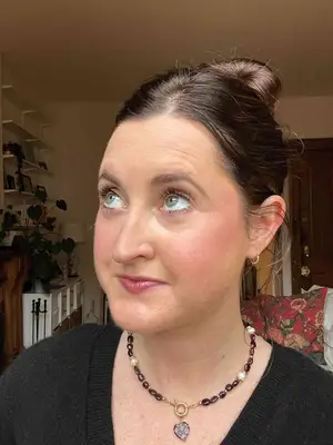 A person after applying the Thrive Causemetics Liquid Lash Extensions Mascara