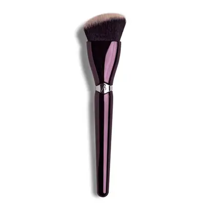 Angled brush with dark purple handle 