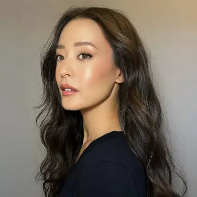 model wearing dewy gold makeup