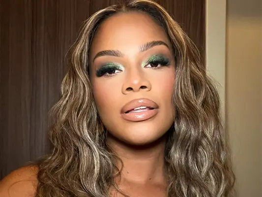 Model wearing green shimmery eyeshadow