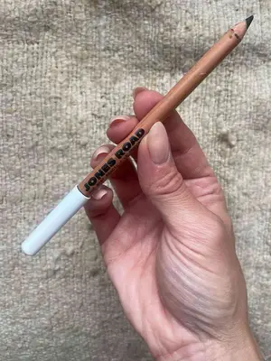 Hand holding Jones Road Beauty The Best Pencil