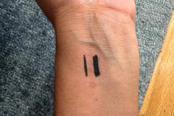 Hand drawing on the back of other hand with Jones Road Beauty The Best Pencil